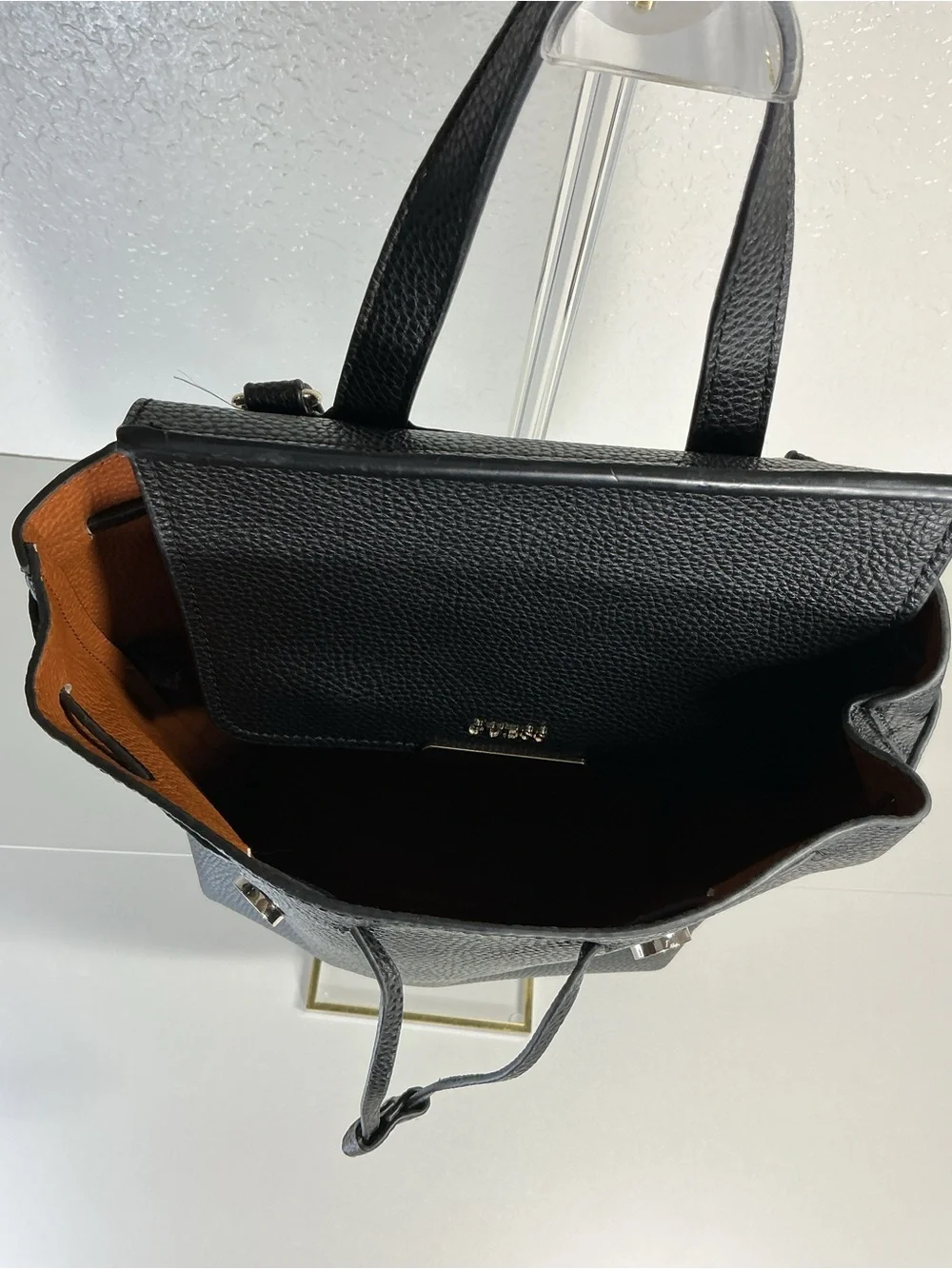 GUESS Black Pebbled Leather Drawstring Backpack with Gold Hardware